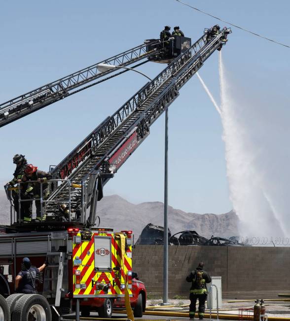 North Las Vegas firefighters try to extinguish a fire around 4565 E. Hammer Lane, Tuesday, Apri ...