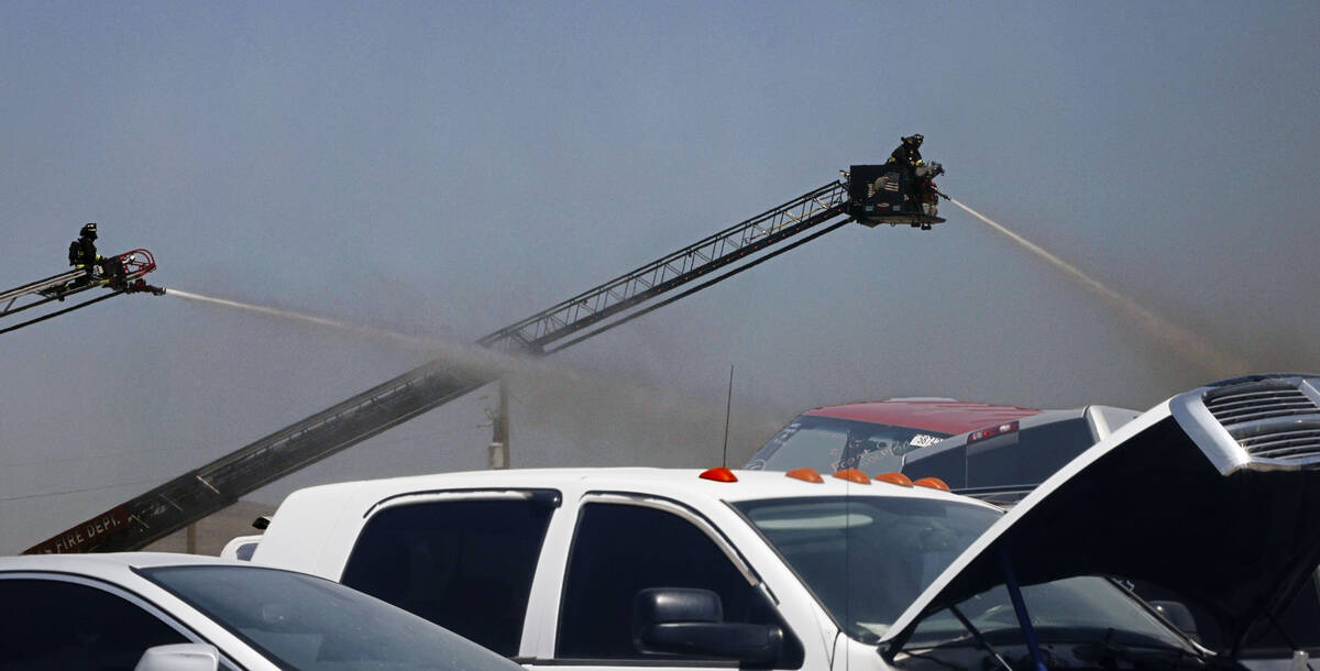 North Las Vegas firefighters try to extinguish a fire around 4565 E. Hammer Lane, Tuesday, Apri ...