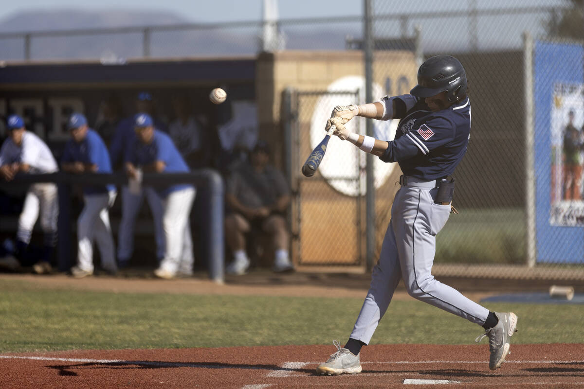 Shadow Ridge shortstop Michael Brown bats during a Class 4A high school baseball game against S ...