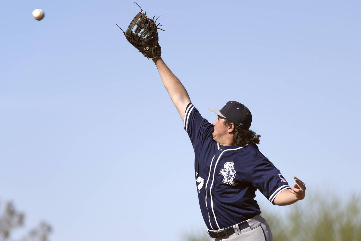 Shadow Ridge first baseman Ian Grafmank jumps to catch for an out on Sierra Vista during a Clas ...