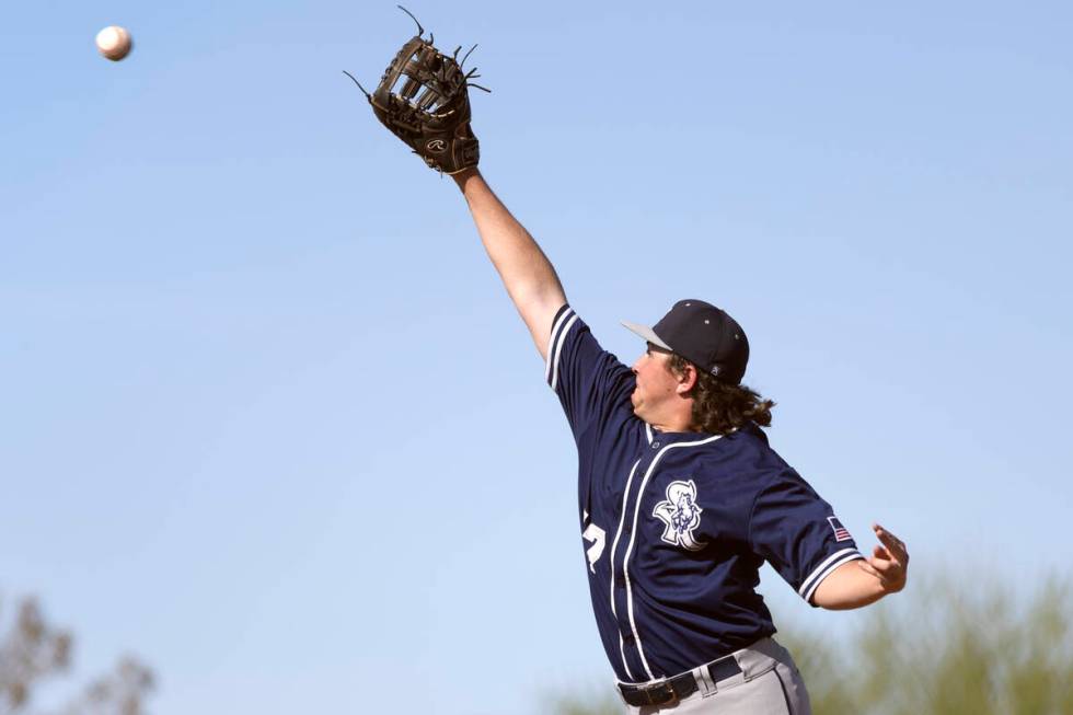 Shadow Ridge first baseman Ian Grafmank jumps to catch for an out on Sierra Vista during a Clas ...