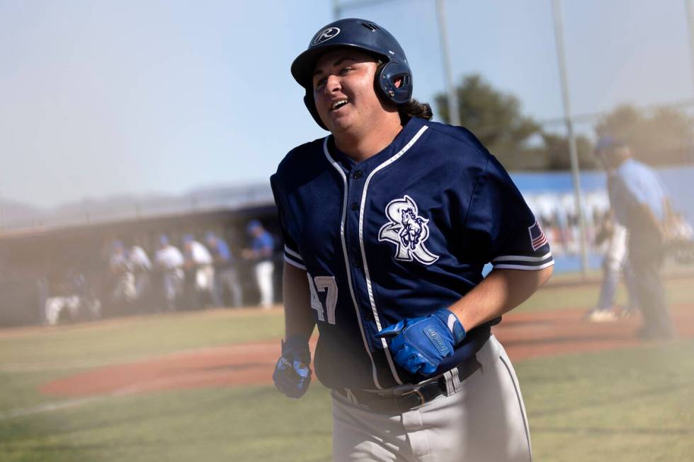 Shadow Ridge’s Ian Grafmank celebrates after scoring an RBI during a Class 4A high schoo ...