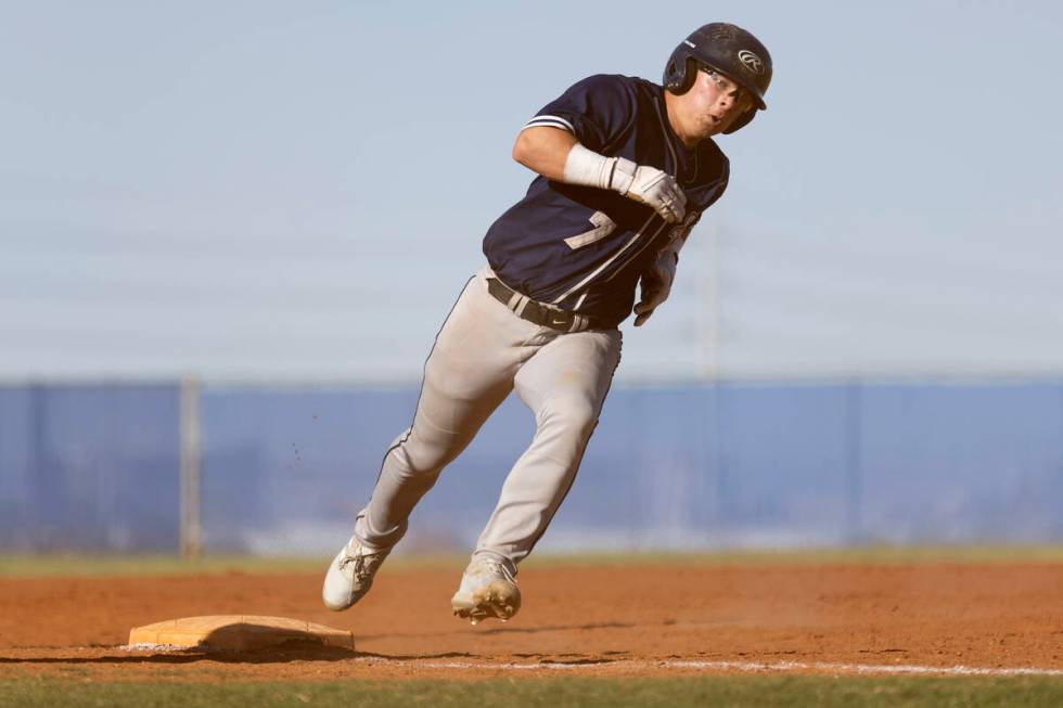 Shadow Ridge outfielder Evan Harnum rounds third base during a Class 4A high school baseball ga ...