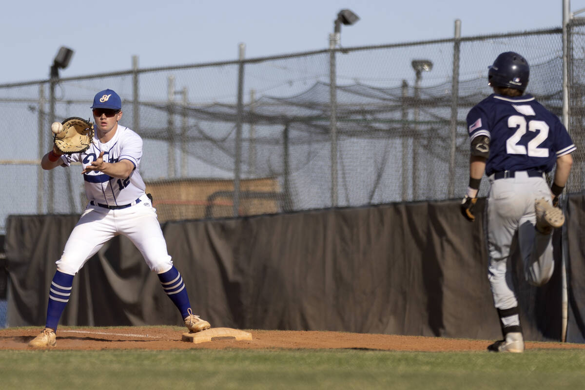 Sierra Vista first baseman Chase Frey (12) catches for an out against Shadow Ridge catcher Aust ...