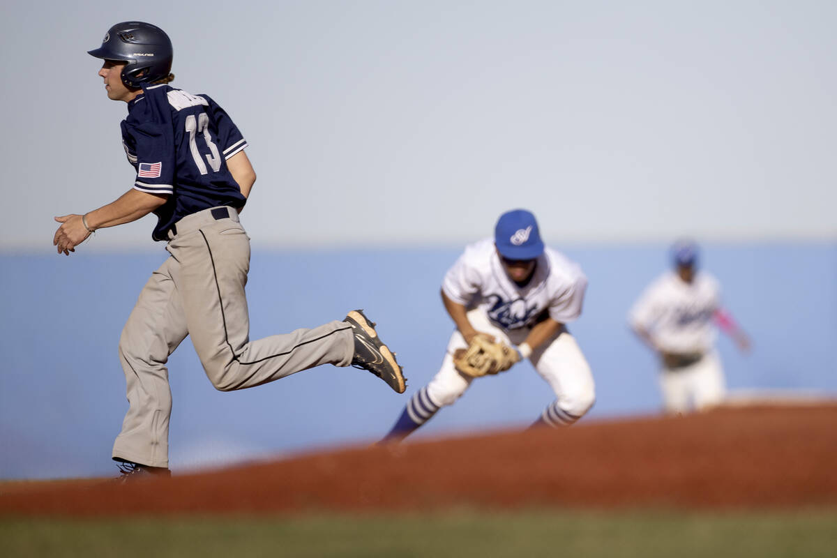 Shadow Ridge’s Rick Andersen (13) runs to second base while Sierra Vista goes for an out ...