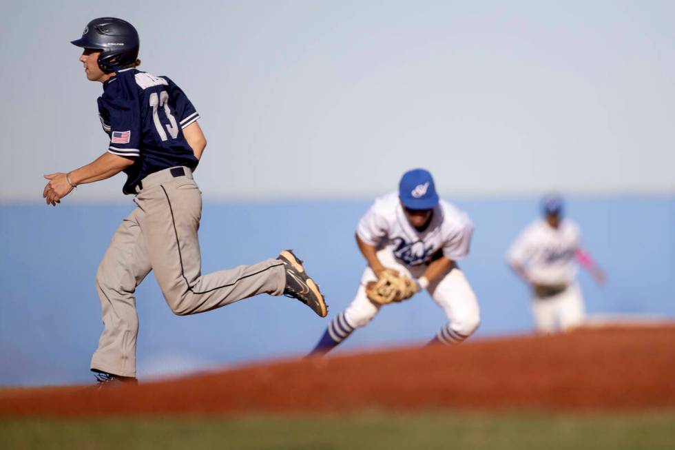Shadow Ridge’s Rick Andersen (13) runs to second base while Sierra Vista goes for an out ...