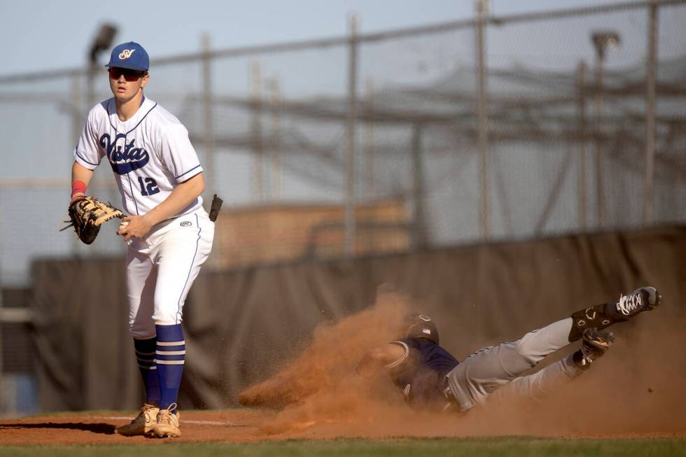 Sierra Vista first baseman Chase Frey (12) already made the out while Shadow Ridge’s Ty ...