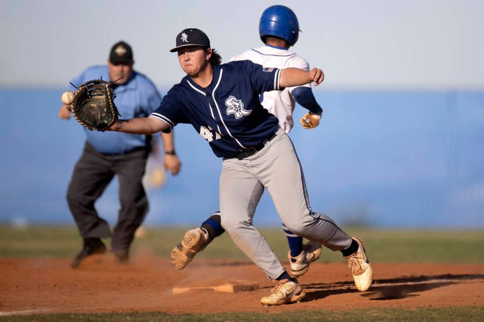 Shadow Ridge first baseman Ian Grafmank reaches to catch while Sierra Vista’s Alex Gueva ...