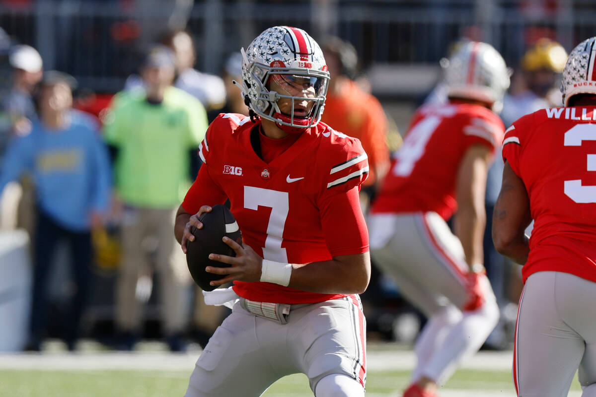 Ohio State quarterback C.J. Stroud drops back to pass against Michigan during the first half of ...