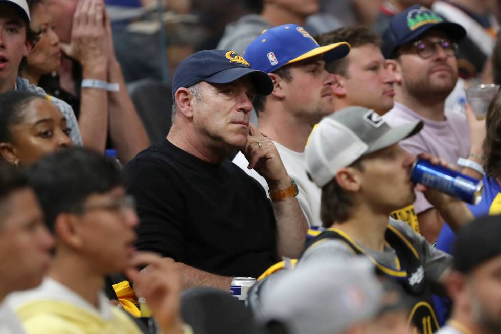 Oakland Athletics owner John Fisher, middle, watches during Game 2 of basketball's NBA Finals b ...