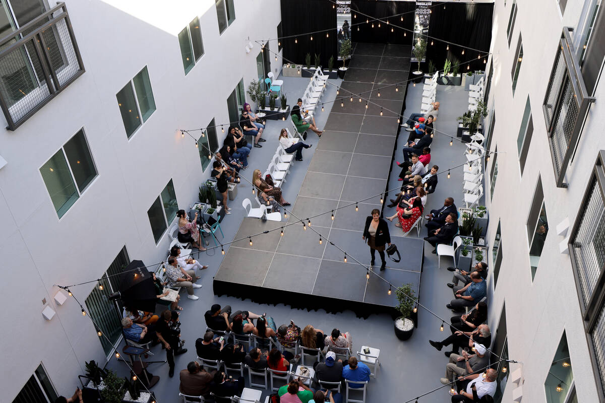 Guests watch a fashion show by Thrifters Anonymous during an opening ceremony for shareDowntown ...