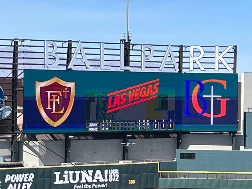 The scoreboard at Las Vegas Ballpark featuring the logos of Faith Lutheran and Bishop Gorman du ...