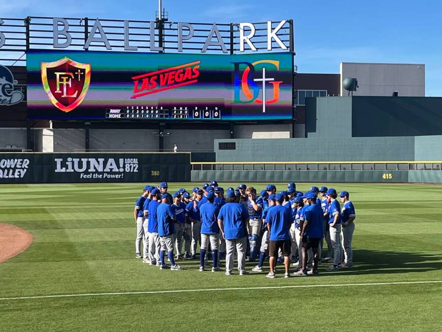 Bishop Gorman huddles around coach Chris Sheff following its 4-2 win over Faith Lutheran Thursd ...