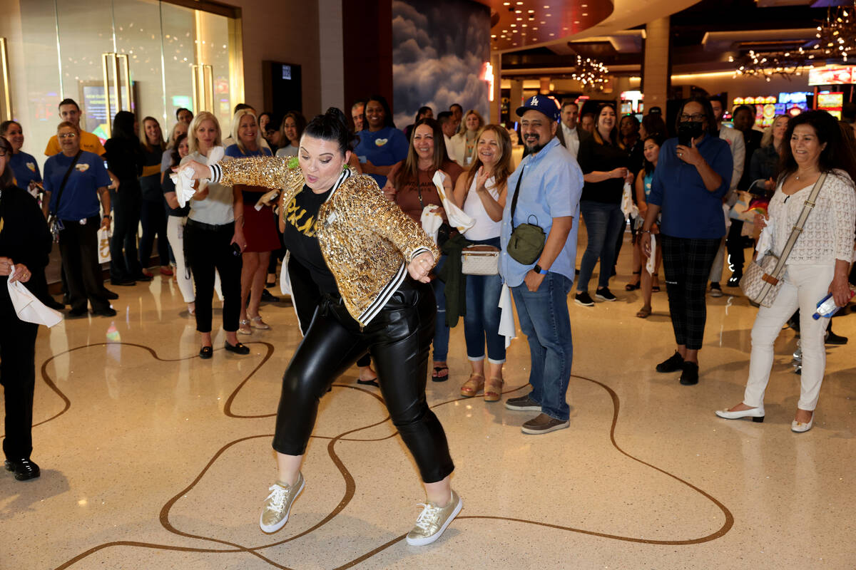 Guest Experience Manager Karrie Kirik dances during a celebration for the one year anniversary ...