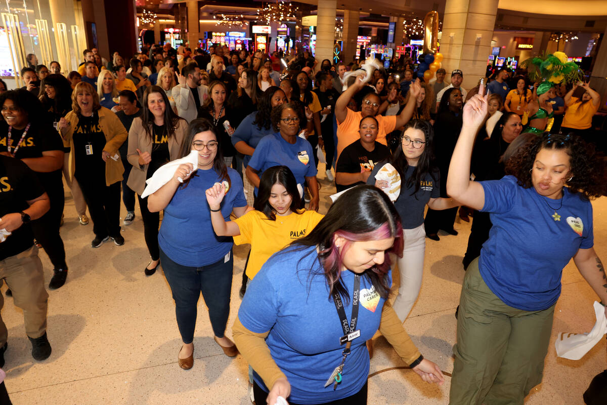 Team members dance during a celebration for the one year anniversary of San Manuel Band of Miss ...