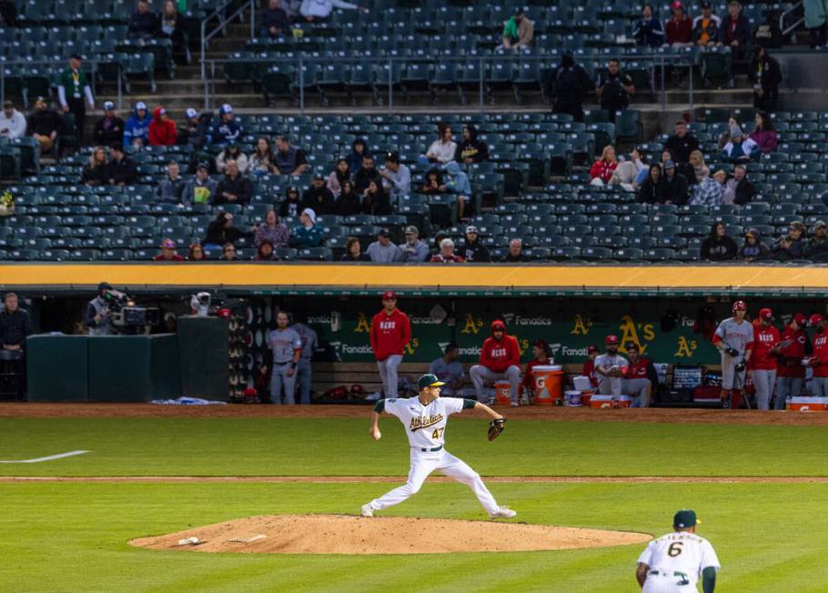 The Oakland Athletics starting pitcher Drew Rucinski delivers against the Cincinnati Reds, on F ...