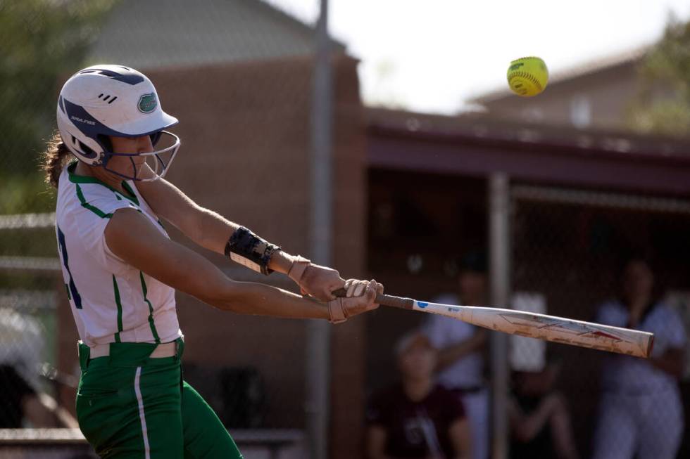 Green Valley shortstop Mikee Morris bats against Faith Lutheran during a high school softball g ...