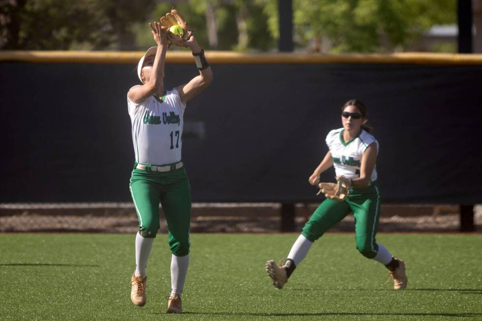 Green Valley’s Mikee Morris (17) catches for an out on Faith Lutheran during a high scho ...