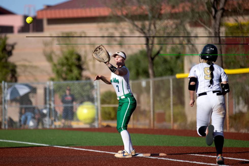 Green Valley first baseman Aspyn Beattie reaches to catch for an out while Faith Lutheran&#x201 ...
