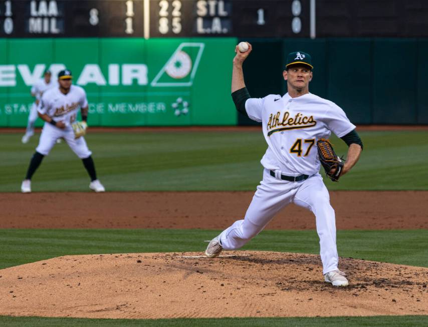 The Oakland Athletics starting pitcher Drew Rucinski delivers against the Cincinnati Reds, on F ...