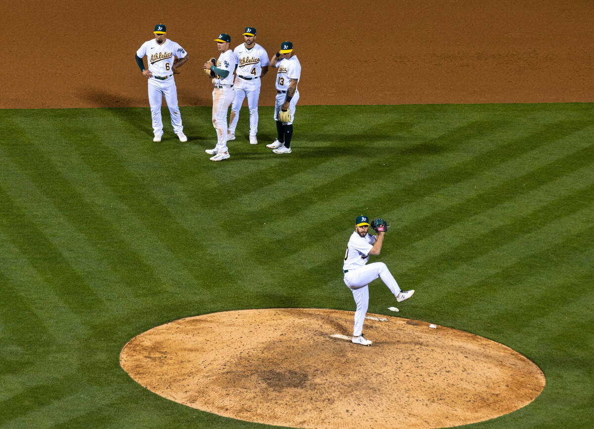 The Oakland A's outfielder Tyler Wade (8) infielders Ryan Noda (49) Kevin Smith (4) and Jordan ...