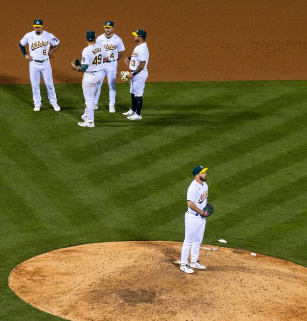 The Oakland A's outfielder Tyler Wade (8) infielders Ryan Noda (49) Kevin Smith (4) and Jordan ...