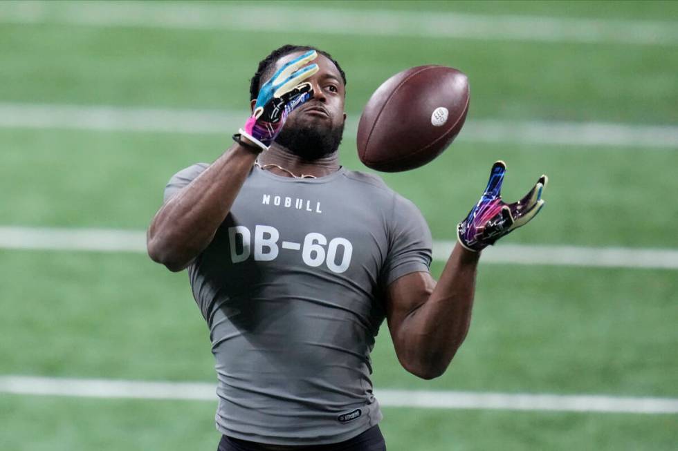 Georgia defensive back Christopher Smith II runs a drill at the NFL football scouting combine i ...