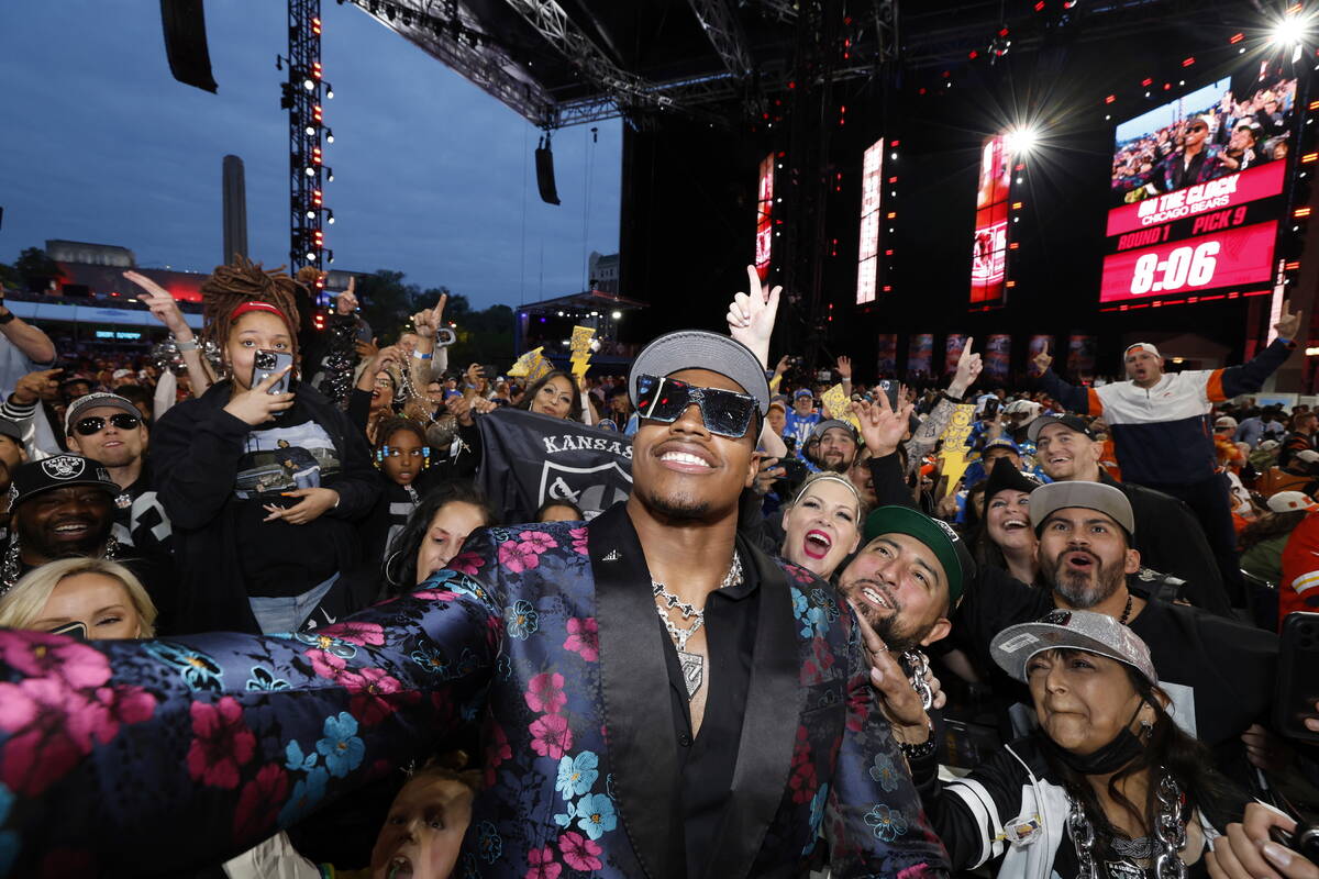 Texas Tech edge Tyree Wilson poses with Las Vegas Raiders fans after being selected with the se ...