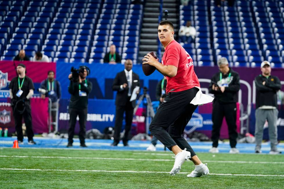 Purdue quarterback Aidan O'Connell runs a drill at the NFL football scouting combine in Indiana ...