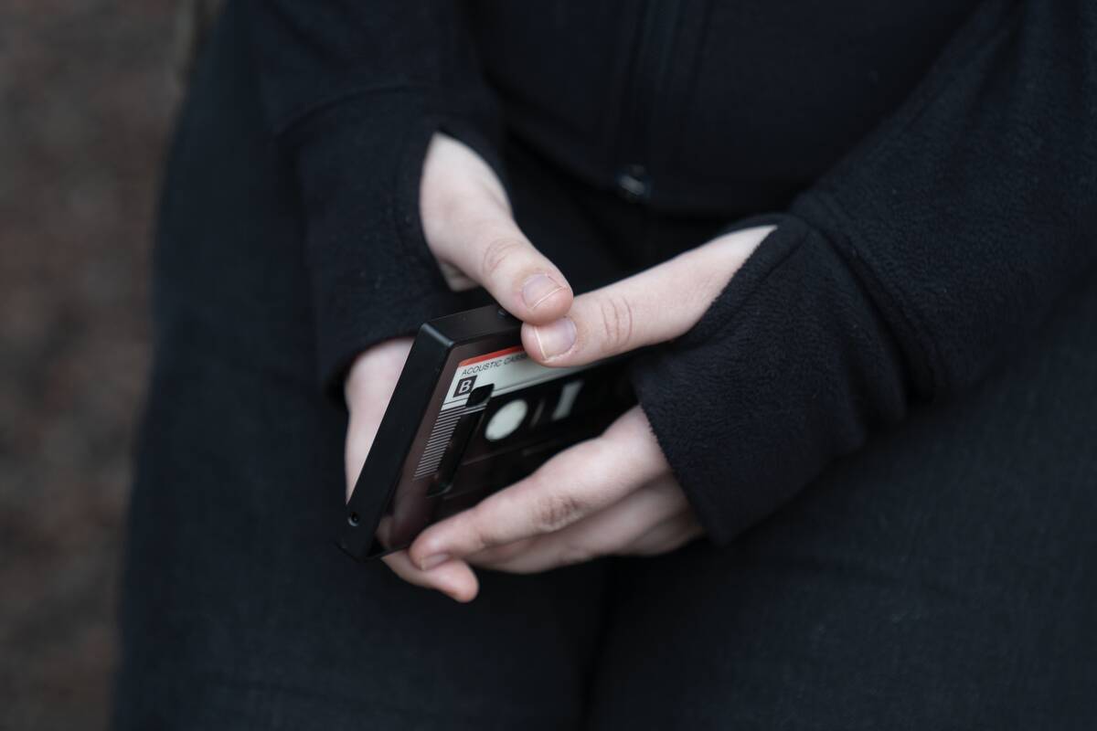 Amelia, 16, holds her phone as she sits for a portrait in a park near her home in Illinois, on ...