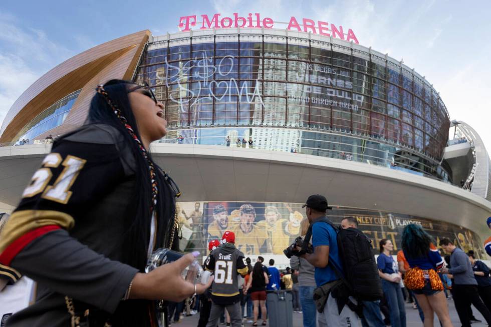 A Golden Knights fan cheers outside T-Mobile Arena before Game 1 of an NHL hockey Stanley Cup s ...