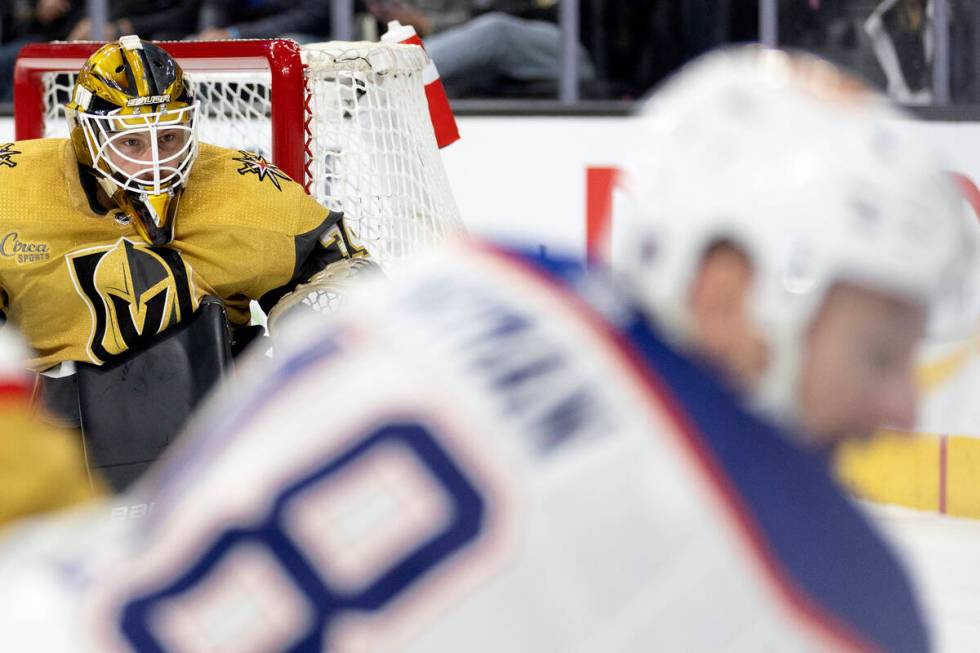 Golden Knights goaltender Laurent Brossoit (39) watches while Edmonton Oilers left wing Zach Hy ...