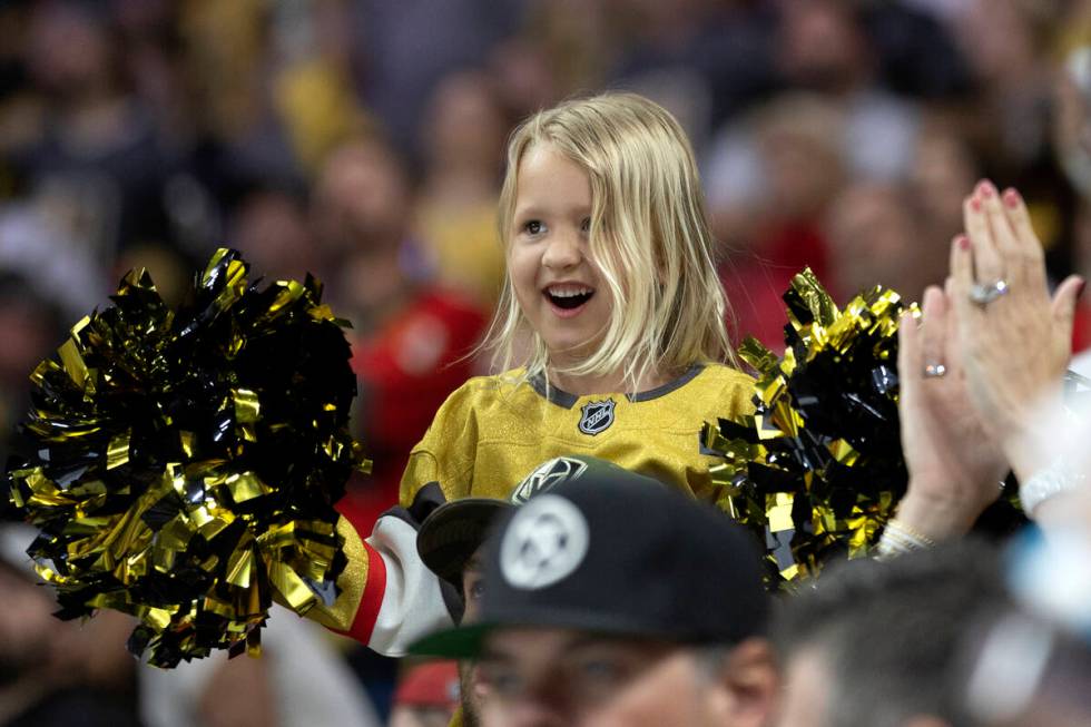 A young Golden Knights fan celebrates after her team scored during the third period in Game 1 o ...