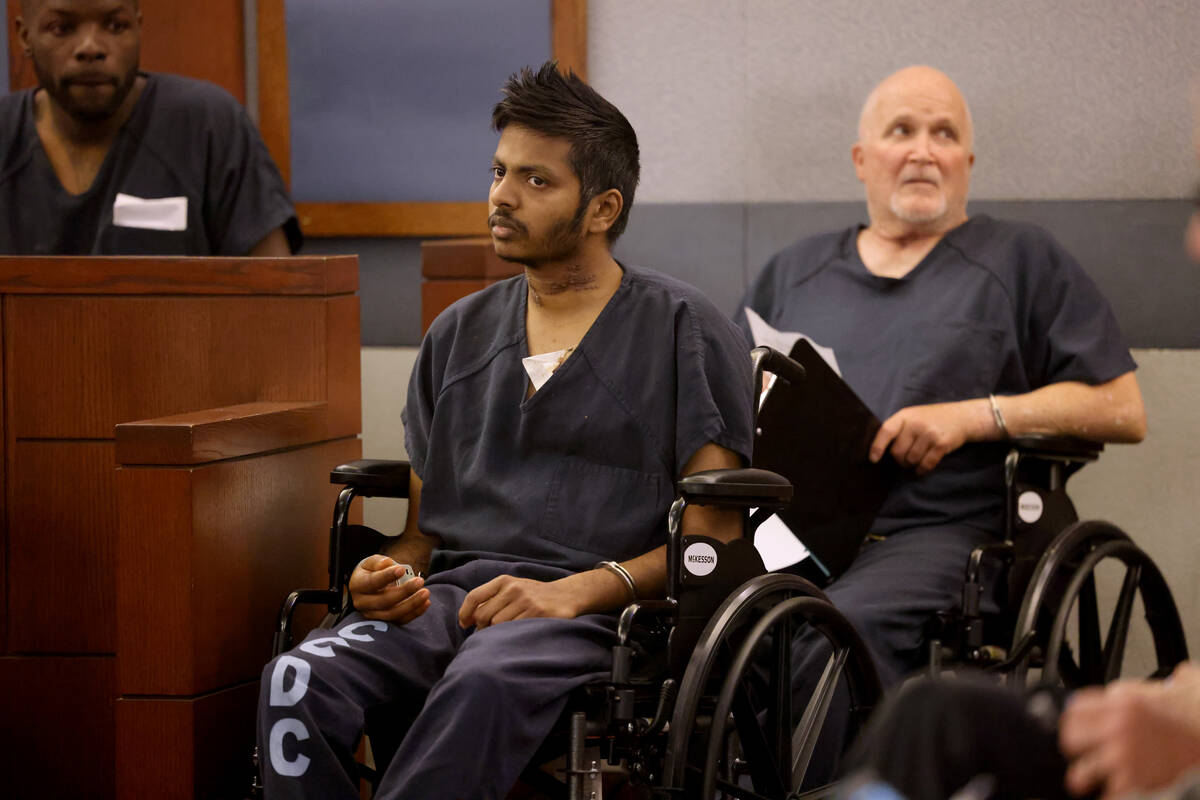 Shiva Gummi, center, accused of murdering his wife, Dr. Gwendoline Amsrala, appears in court at ...