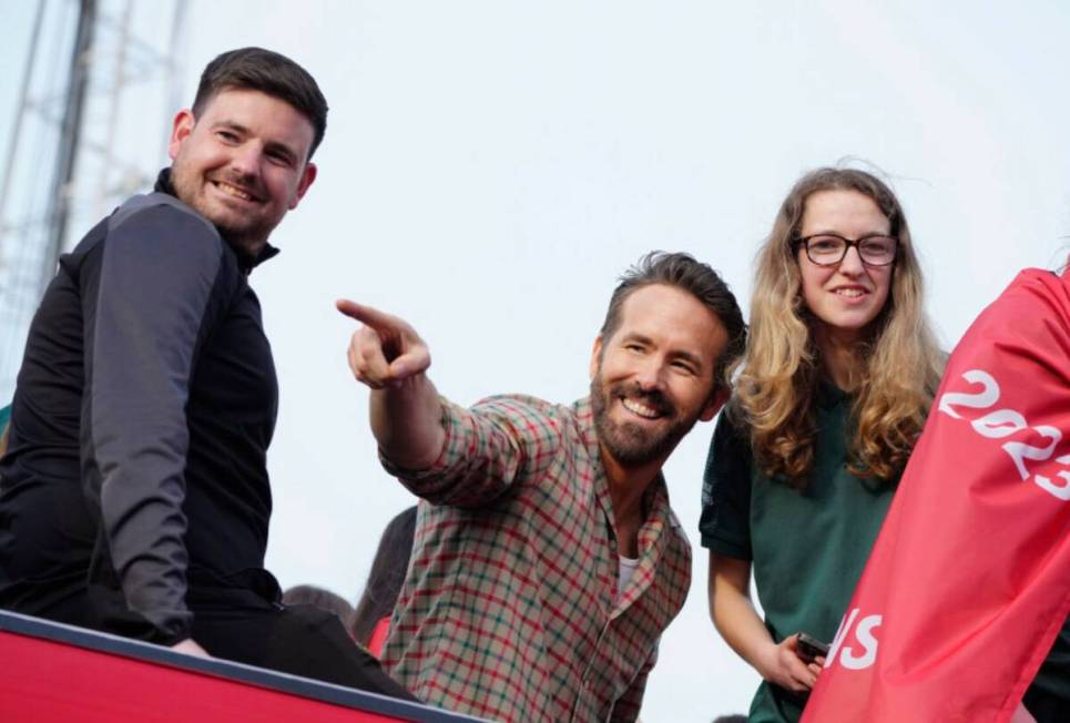 Wrexham co-owner Ryan Reynolds, center, celebrates with members of the Wrexham FC soccer team t ...