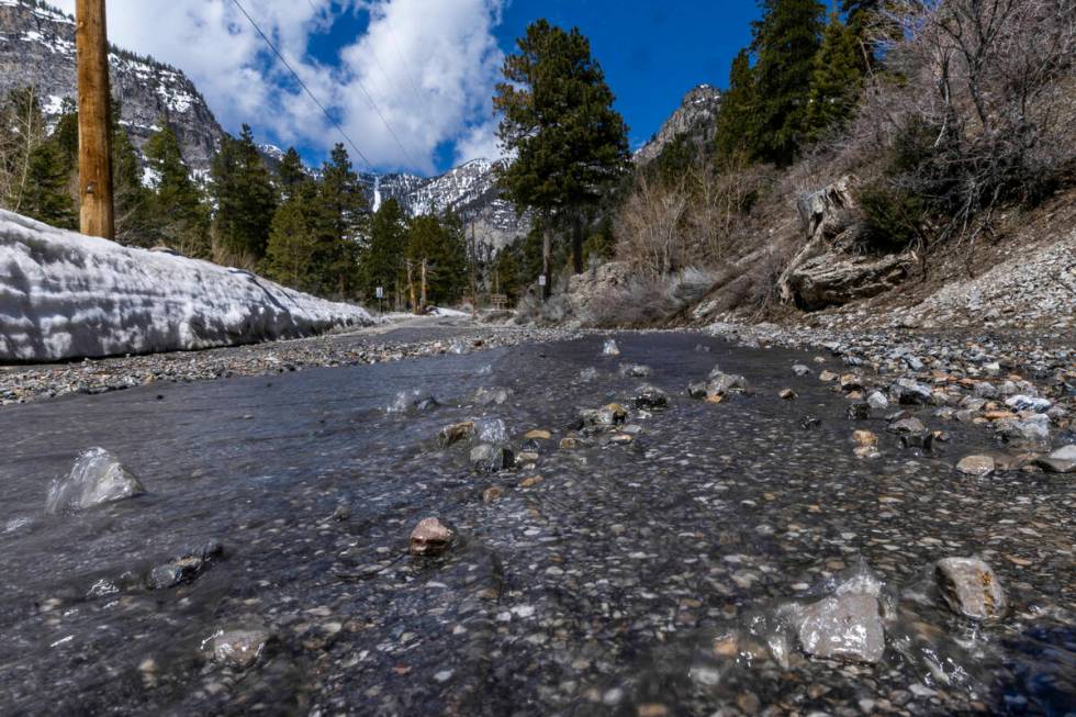 Snowmelt and smaller rocks move down Echo Road within Kyle Canyon on Mount Charleston on April ...