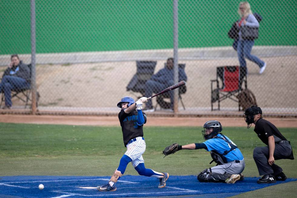 Green Valley shortstop Jacob Ferry bats against Centennial during a high school baseball game a ...