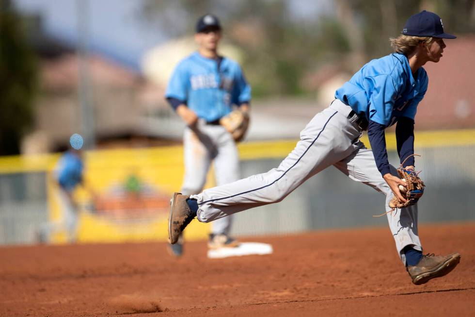 Centennial infielder Ethan Santos prepares to throw to first base during a high school baseball ...
