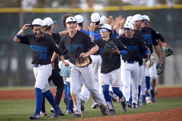 Green Valley celebrates after winning a high school baseball game against Centennial at Green V ...