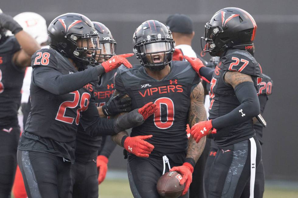 Vegas Vipers linebacker Pita Taumoepenu celebrates his fumble recovery against DC Defenders wit ...