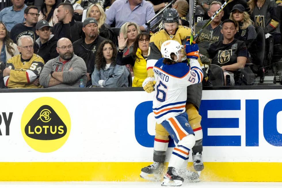 Edmonton Oilers right wing Kailer Yamamoto (56) slams Golden Knights defenseman Brayden McNabb ...