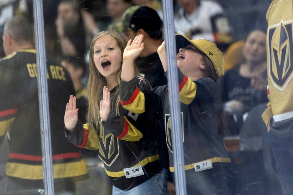Young Golden Knights fans cheer for their team during the second period in Game 2 of an NHL hoc ...