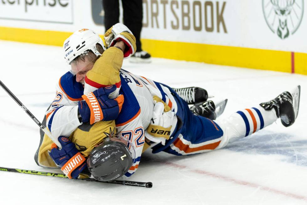 Golden Knights defenseman Alex Pietrangelo (7) and Edmonton Oilers center Nick Bjugstad (72) fi ...