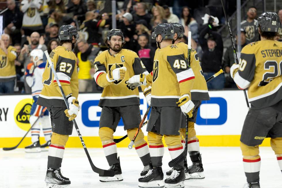 The Golden Knights celebrate after center Ivan Barbashev (49) scored during the third period in ...