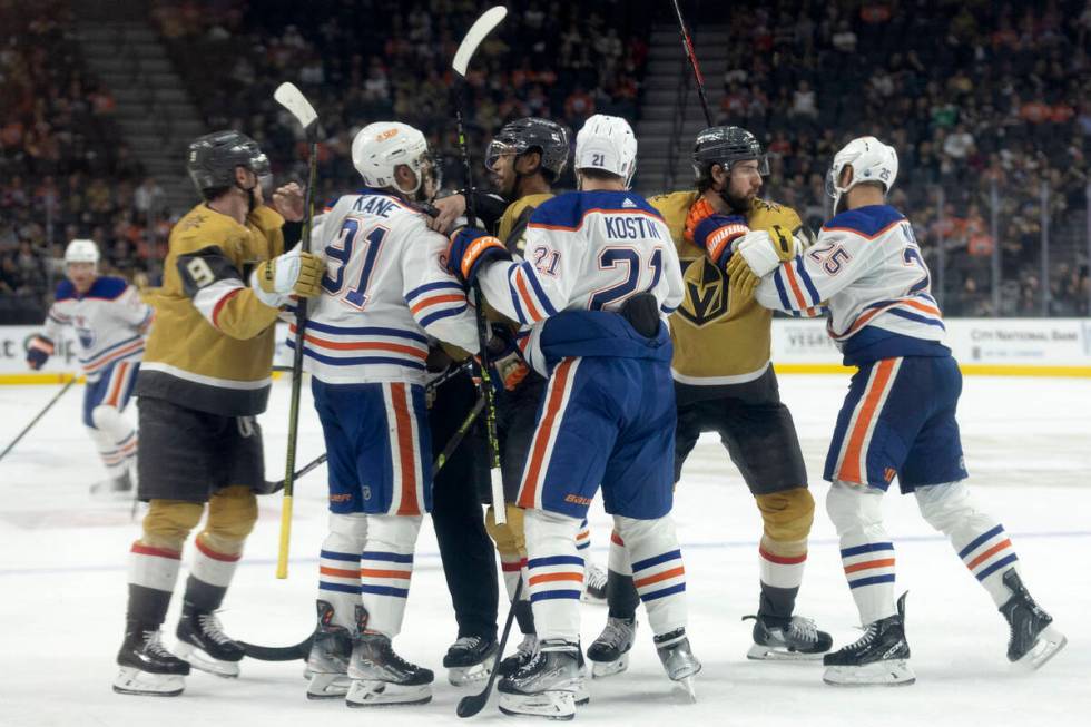 The Golden Knights fight with the Edmonton Oilers during the third period in Game 2 of an NHL h ...