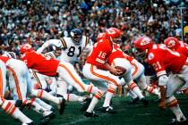 In this Jan. 11, 1970, file photo, Kansas City Chiefs quarterback Len Dawson (16) turns around ...