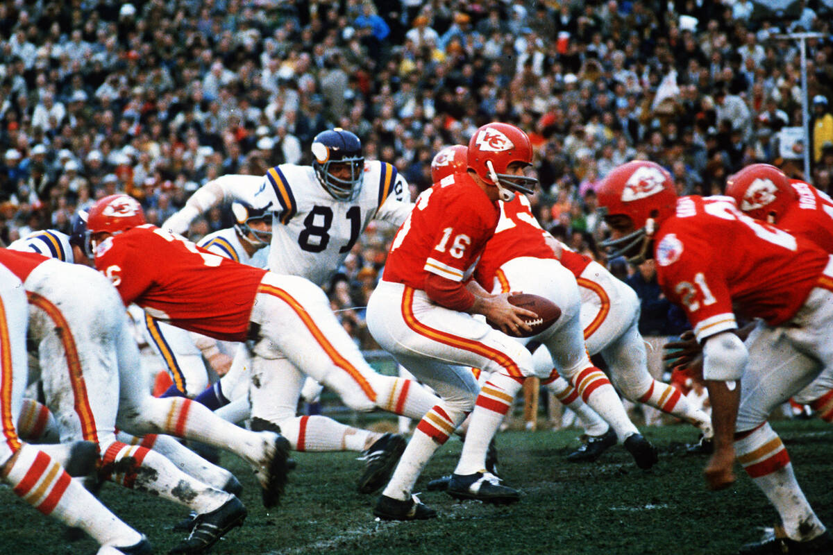 In this Jan. 11, 1970, file photo, Kansas City Chiefs quarterback Len Dawson (16) turns around ...