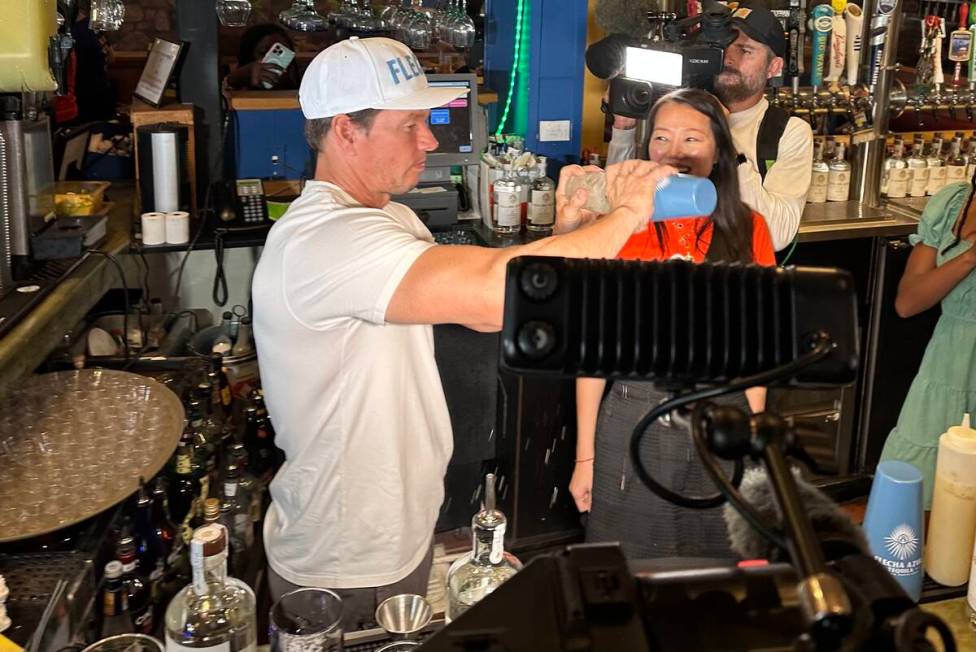 Mark Wahlberg tends bar and pours Flecha Azul tequila shots during an appearance at On The Bord ...
