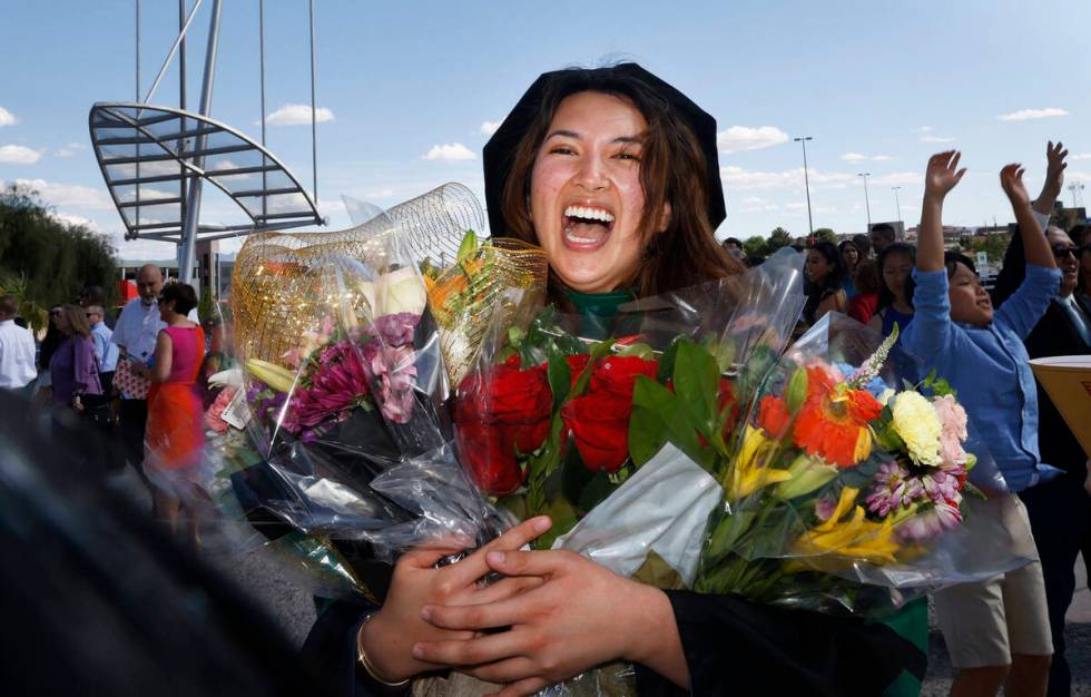 Monica Celine Layson Fortich smiles for a photo after the commencement and academic hooding cer ...