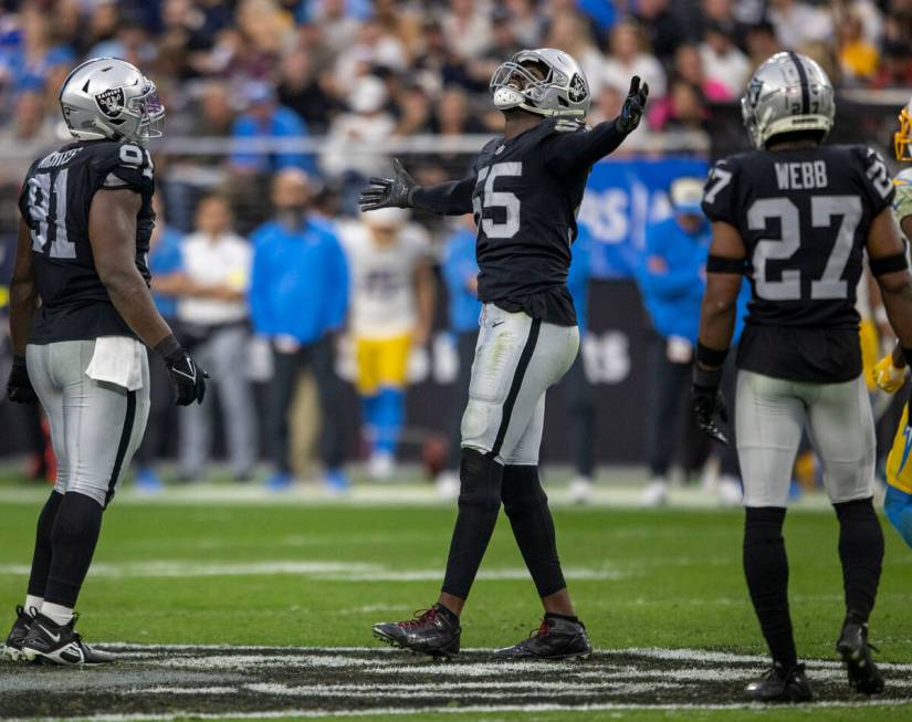 Raiders defensive end Chandler Jones (55) celebrates a sack of Los Angeles Chargers quarterback ...